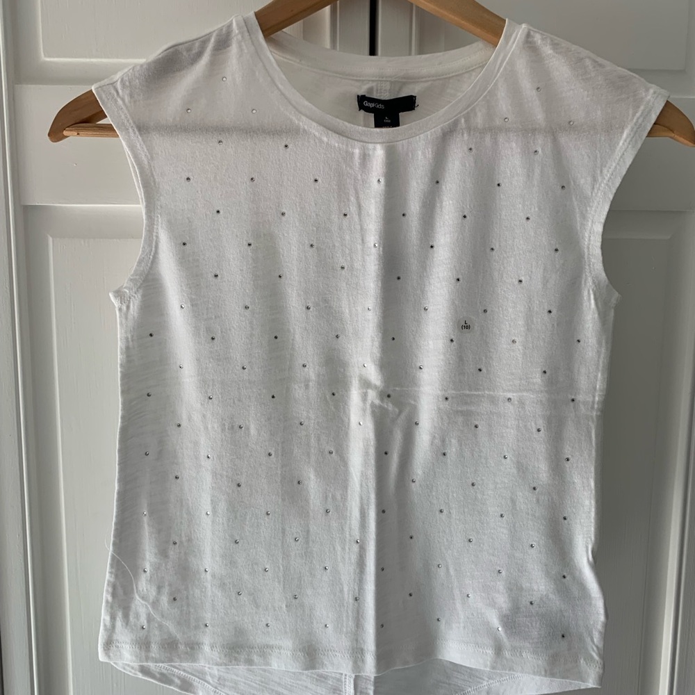 White tank with rhinestone front.